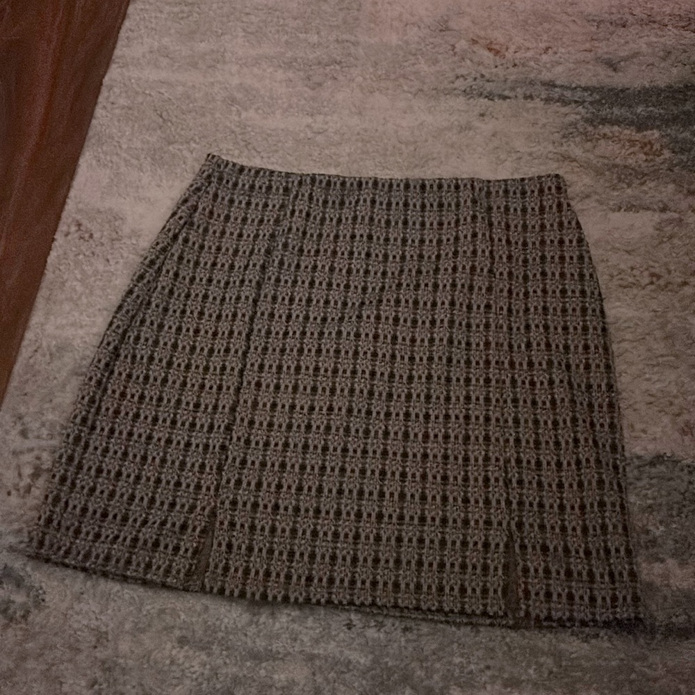A small boxed, plaid mini skirt.